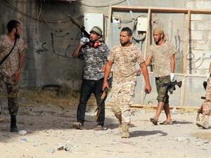 Forces loyal to Libya's UN-backed unity government patrol the city of Sirte, 450 kilometres (280 miles) east of Tripoli, during an operation to recapture the city from the Islamic State (IS) Jihadists, on June 12, 2016. (AFP/Stringer)