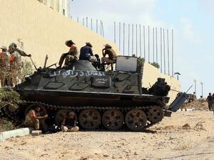 Forces loyal to Libya's Government of National Accord (GNA) hold a position in the area known as District Three in the west of the coastal city of Sirte on September 3, 2016 as they attack the last positions of Daesh in the city. (AFP/Mahmud Turkia)