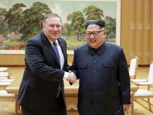 US Secretary of State Mike Pompeo, left, with North Korea leader Kim Jong Un (AFP Photo)