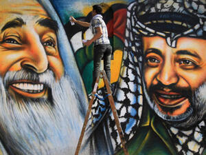 Graffiti in Gaza City of Sheikh Yassin (L), late leader of Hamas, and Yasser Arafat, late leader of Fath.(Mahmud Hams/AFP)