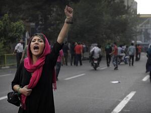 Women protest the mandatory hijab law in Iran. (AFP/File Photo)