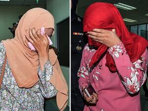 An image shows two women who were each caned six times on Sept. 3, 2018, in Malaysia.
(Photo from EPA-EFE)