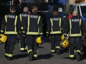 Members of the Fire Brigade walk near Manchester Arena (AFP/File Photo)	