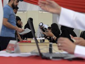 Bahraini voters cast their ballot for parliamentary election at a polling station in the Bahraini city of Al-Muharraq, north of Manama on November 24, 2018. (AFP)