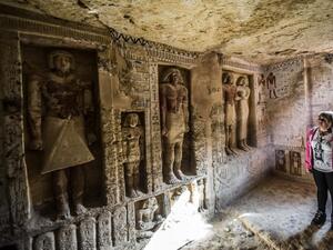 Guests enter a newly-discovered tomb at the Saqqara necropolis belonging to the high priest "Wahtye" who served during the fifth dynasty reign of King Neferirkare. (AFP)