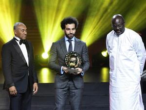 Confederation of African Football (CAF) President Ahmad Ahmad (L) poses after he handovered the 2018 African Footballer of the Year Award to Mohamed Salah. (AFP/File)