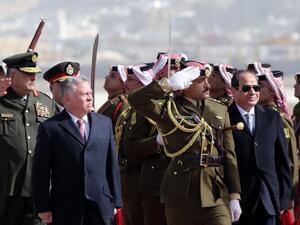 King Abdullah II of Jordan (L) and Egyptian President Abdel Fattah al-Sisi review an honour guard upon Sisi's arrival at Marka International Aiport, in the Jordanian capital Amman on January 13, 2018.(AFP)