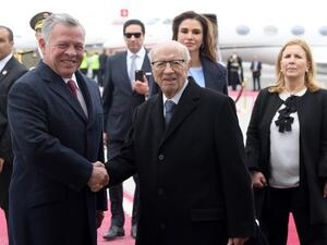 Tunisian President Beji Caid Essebsi (C) greets Jordanian King Abdullah II (L) upon his arrival in the capital Tunis on February 3, 2019. (AFP)

