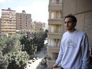 Egyptian photojournalist Mahmoud Abu Zeid, widely known as Shawkan, carries his camera at his home in the capital Cairo on March 4, 2019. (Khaled DESOUKI / AFP)
