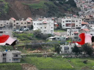 Syrian national flags are flown in the Syrian town Ain al-Tineh across from Majdal Shams in the Israeli-annexed Golan Heights on March 26, 2019. (Louai Beshara / AFP)