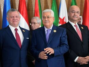 (L to R) Jordan's King Abdullah II, Palestinian president Mahmoud Abbas, and Iraqi President Barham Saleh pose together for the group family photo with other Arab leaders. (AFP/ File)