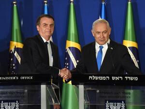 Brazilian President Jair Bolsonaro (L) and Israeli Prime Minister Benjamin Netanyahu shake hands during a joint press conference at the prime minister's residence in Jerusalem on March 31, 2019. (AFP/ File)