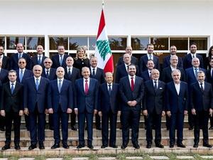Lebanese President Michel Aoun (first row C), Prime Minister Saad Hariri (first row C-R), and Parliament Speaker Nabih Berri (first row C-L) posing with members of the newly-formed cabinet. (AFP)
