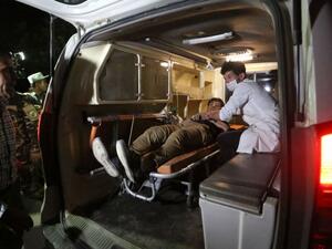 An injured Afghan man lies on a stretcher in an ambulance near the site of an explosion. (AFP/ File Photo)