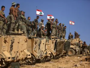 Lebanese soldiers stand on armoured vehicles on a hill they took from the Islamic State (IS) group in Jurud Ras Baalbek on the Syrian-Lebanese border. (AFP/File)