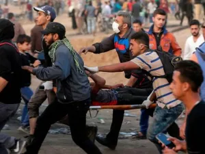 Palestinians evacuate an injured protestor during clashes near the Israeli border fence in Gaza.(AFP/ File Photo)