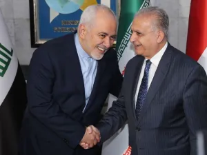 Iraqi Foreign Minister Mohammad Ali al-Hakim (R) receives his Iranian counterpart, Mohammad Javad Zarif, in Baghdad on January 13, 2019 (AFP Photo/SABAH ARAR)