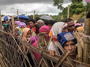 Rohingya refugees from Myanmar line up at an aid relief distribution center at the Balukhali refugee camp near Cox's Bazar in southeastern Bangladesh. (AFP)