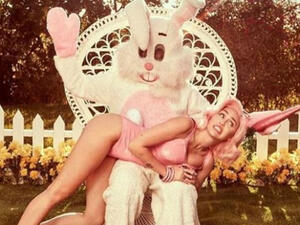 Back at it: Miley Cyrus followed Saturday's sexy photo session by unveiling three risque videos that came from the same shoot (Source: Miley Cyrus - Instagram)