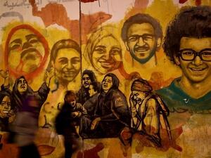 A mural depicting those killed during the November 2011 protests on Mohamed Mahmoud Street. (AFP)