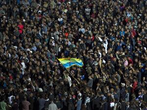 Protesters wave the Amazigh (Berber) flag as they shout slogans in the northern city of Al Hoceima on October 30, 2016, following the death of fishmonger Mouhcine Fikri, who was crushed to death on October 28 in a rubbish truck in Al Hoceima. (AFP/Fadel Senna)