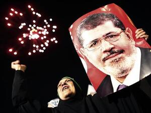 Experts say Morsi could face the death penalty in his upcoming trial this Tuesday in the latest of a series of harsh sentences handed down to Brotherhood affiliates in Egypt. (AFP/File)