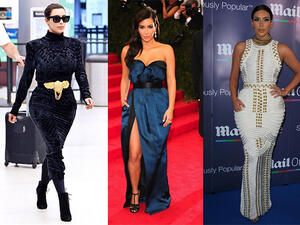 كيم كارداشيان وقد زيينت خصرها بحزام ذهبي عريض