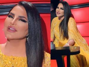 اختارت أحلام لإطلالتها فستان باللون الأصفر بتصميم "الكاب" Cape Dress