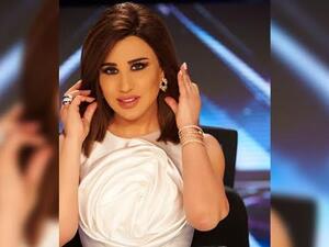 نجوى كرم تختار إطلالة باللون الأبيض ودرجات البيج في عرب غوت تالنت