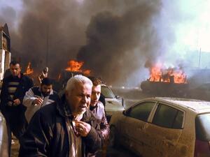 An image grab shows people gathering amidst the debris at the site of a car bomb attack in the rebel-held town of Azaz in northern Syria. (AFP/File)