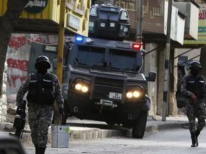 Jordanian security forces secure a street in the town of Irbid, 80km north of the capital Amman, near the border with Syria. (AFP/File)