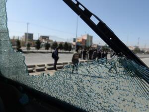 Afghan forces are seen through the shattered glass of a bus caught in a roadside bombing in Kabul. Improvised explosives are one of the main causes of civilian casualties. (AFP/File)