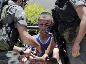 Israeli forces detain four Palestinian children for throwing stones. (AFP/File)