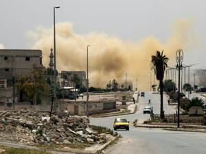 Smoke rises on a main road in the Salaheddin neighbourhood of Aleppo following a reported air strike on April 24, 2016. (AFP/File)