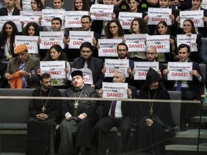 Armenian clergy men and activists react after lawmakers voted to recognize the Armenian genocide. (AFP/File)