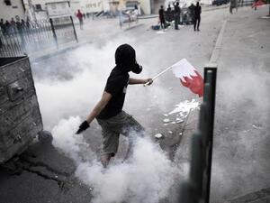 A pro-democracy protester surrounded by teargas in Bahrain. (Twitter)