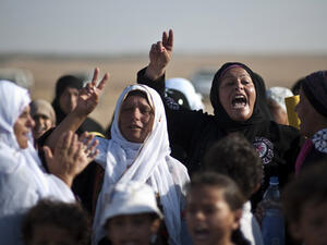 Bedouin women shout slogans during a protest in the Negev desert. (AFP/File)