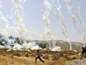 Tear gas canisters rain down on demonstrators in the West Bank village of Bilin. (AFP/File)
