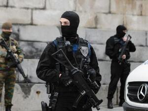 Belgian security forces stand guard outside the Brussels Palace of Justice on November 20, as two suspects appeared to answer charges in connection over the attacks in Paris. (AFP/Nicolas Lambert)