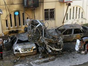 People inspect the wreckages of burnt cars on May 1, 2015. (AFP/File)
