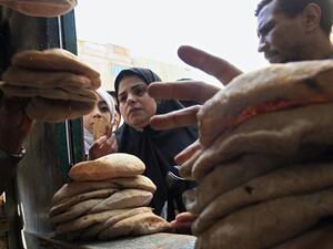 A woman stands in line for subsidised bread. (AFP/File)