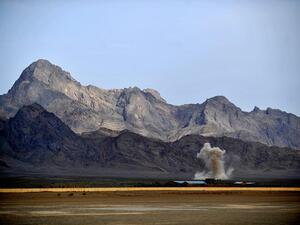 An explosion is set off in the distance in Farah province. (AFP/File)