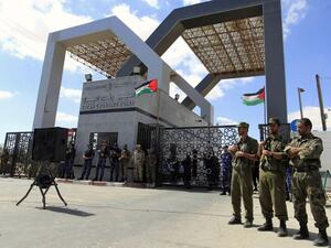 Members of Hamas' security forces standing guard in front of the Rafah border crossing with Egypt in the southern Gaza Strip, September 16, 2013. (AFP/Said Khatib)