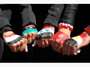 Yemeni women show their hands painted with flags of Arab nations. (AFP/File)
