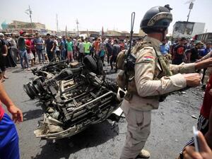 Iraqi army officials inspect the aftermath of Wednesday's car bomb attacks. (Twitter)