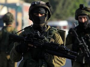 Israeli soldiers patrol a street, east of the West Bank city of Nablus. (AFP/File)
