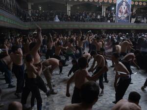 Afghan Shia Muslims conduct self-flagellation rituals as part of the Ashura commemorations at a Kabul mosque on October 9, 2016. (AFP/Shah Marai)