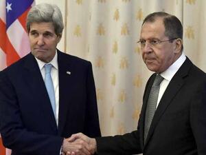 Russian Foreign Minister Sergei Lavrov shakes hands with US Secretary of State John Kerry during their meeting in Moscow on December 15, 2015. (AFP/File)
