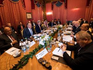 Officials from the US, Russia, Syria, Egypt, Qatar, Iraq, Iran, Turkey, Jordan and the UN gather to speak during a meeting to revive a ceasefire in Syria, in Lausanne, on October 15, 2016. (AFP/Jean-Christophe Bott)