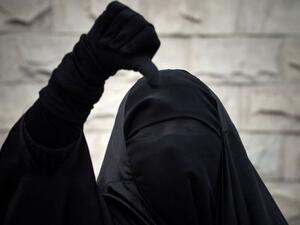 A Bahraini Shia Muslim woman wearing the niqab shouts anti-government slogans during a demonstration. (AFP/Mohammed Al Sheikh)